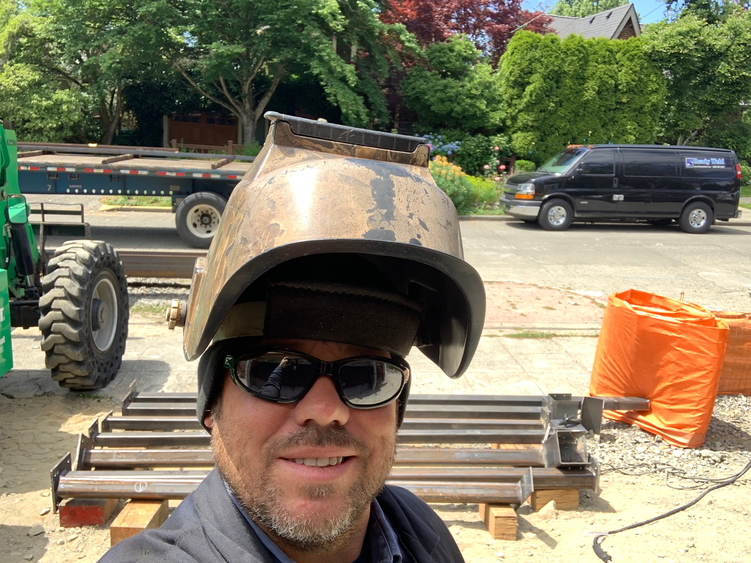 Construction worker in safety helmet and sunglasses at work site